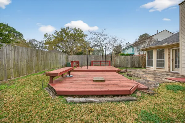 a backyard of a house with table and chairs