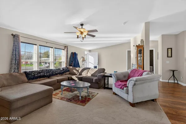 a living room with furniture and a large window