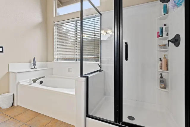 a bathroom with a tub and a sink