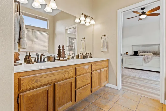 a spacious bathroom with a double vanity sink mirror and