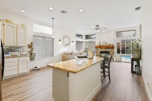 a open kitchen with sink cabinets and wooden floor