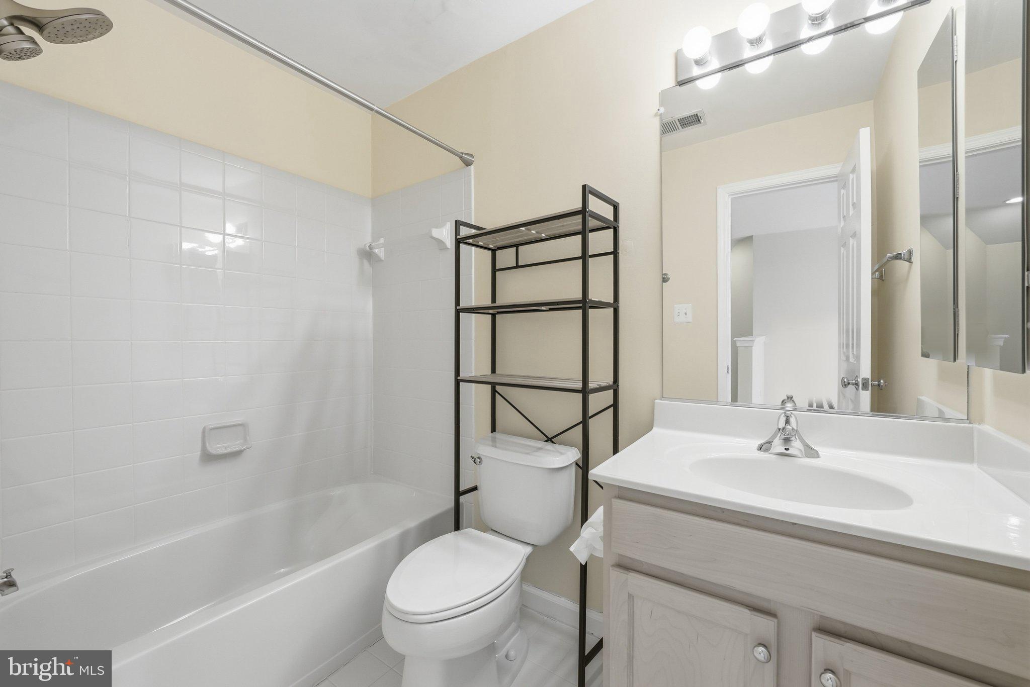 3679 Expedition Drive Triangle, VA 22172 - Photo 40 of 65 a bathroom with a sink toilet and shower