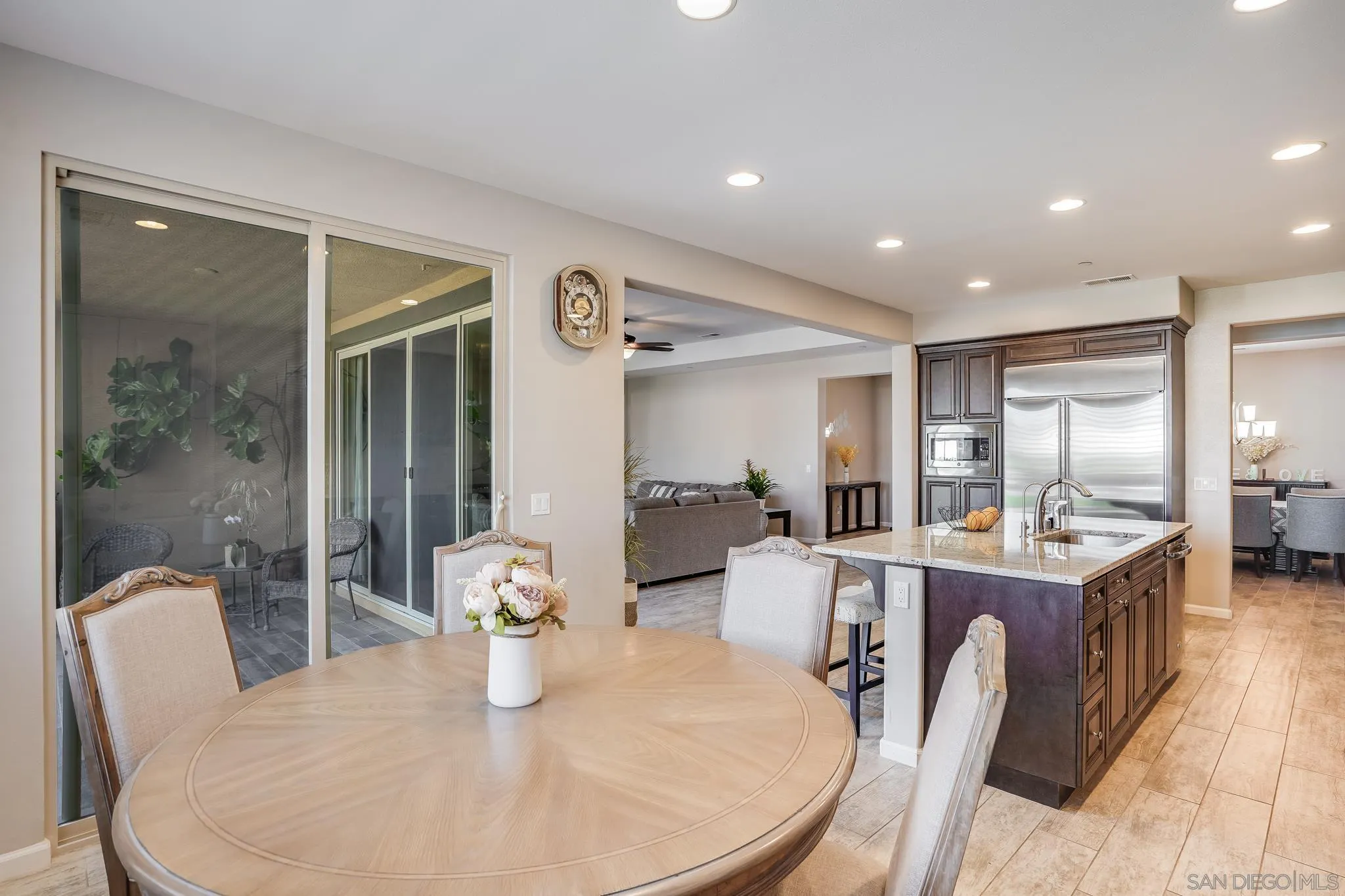 5662 Rancho Del Caballo Bonsall, CA 92003 - Photo 13 of 60 a dining room with furniture and wooden floor