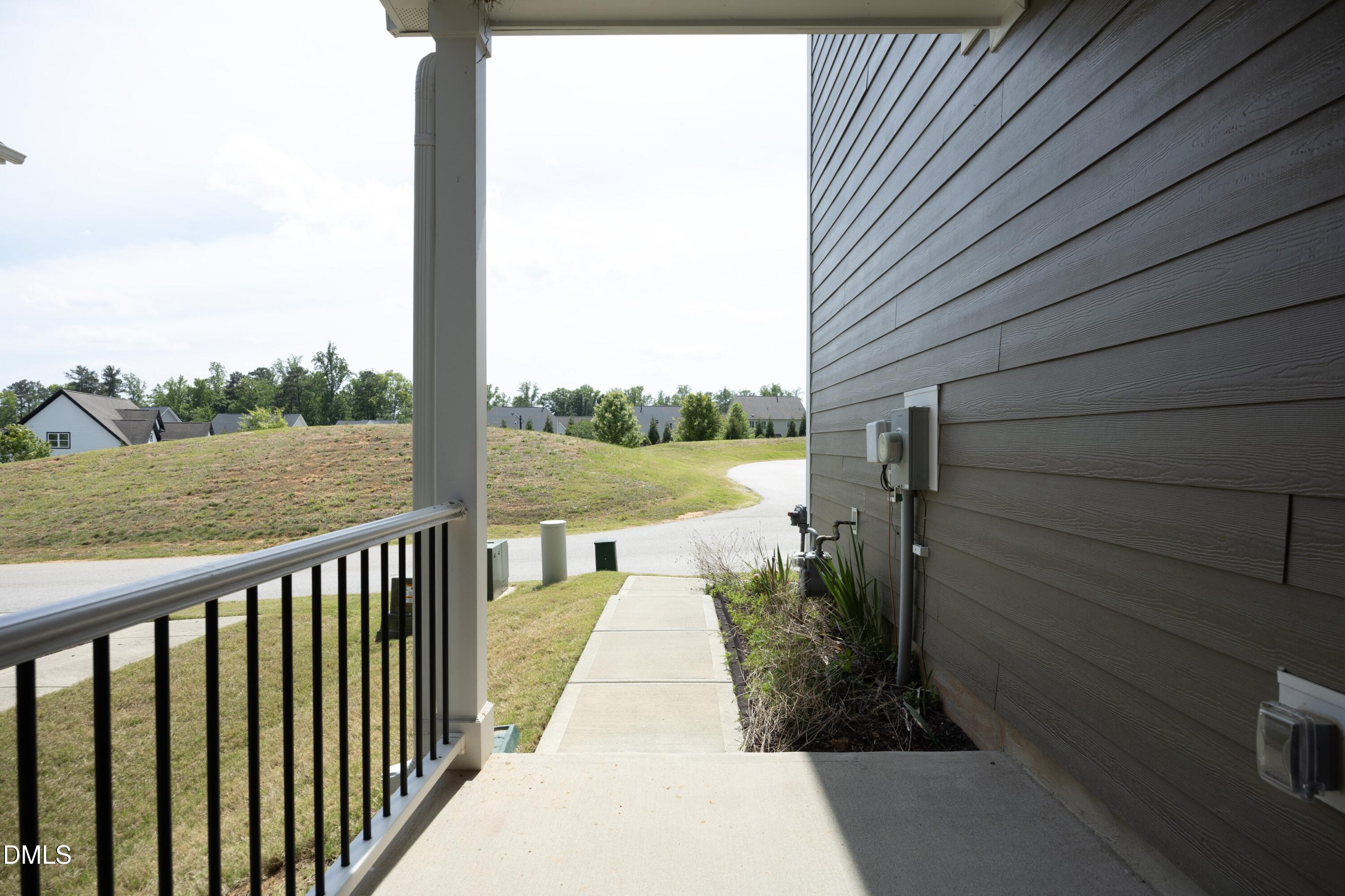 824 Country Downs Road Wake Forest, NC 27587 - Photo 9 of 41 a view of a pathway with a balcony