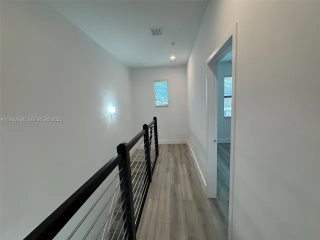 a view of stairs with wooden floor