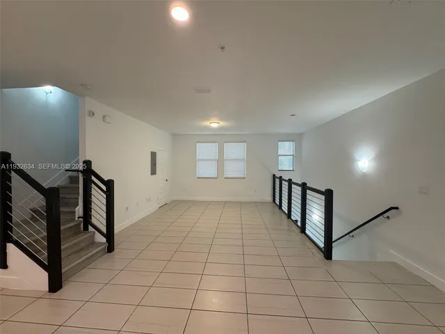 a view of a hallway with windows