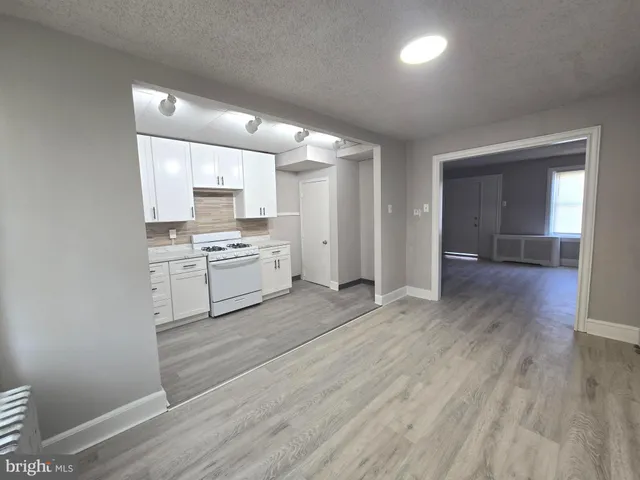 a view of kitchen with wooden floor