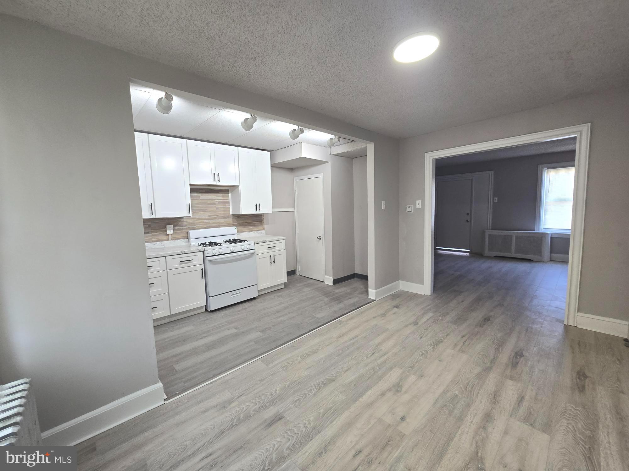 2642 South 67th Street Philadelphia, PA 19142 - Photo 5 of 23 a view of kitchen with wooden floor
