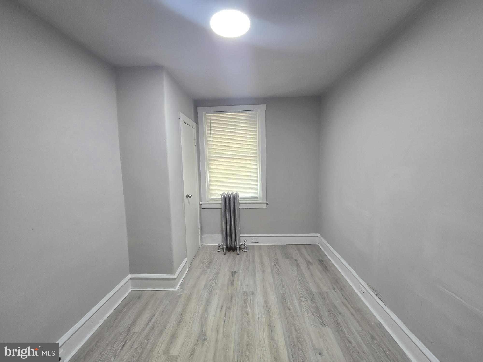 2642 South 67th Street Philadelphia, PA 19142 - Photo 10 of 23 a view of a room with wooden floor and a window