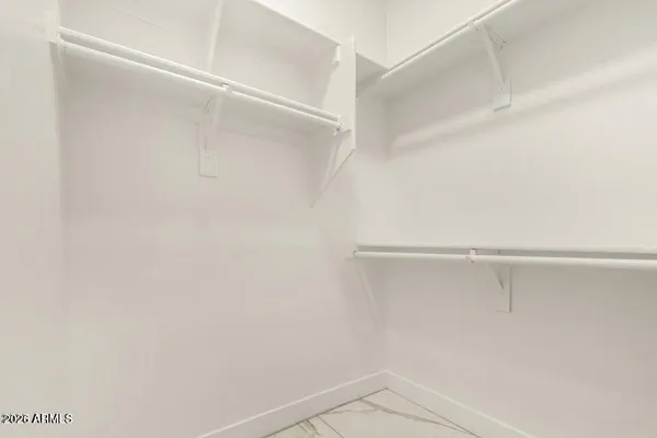 a view of an empty walk in closet