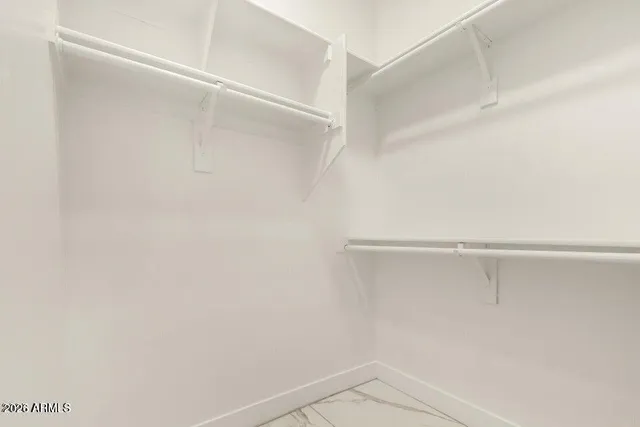 a view of an empty walk in closet