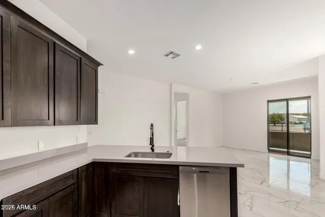 a kitchen with a sink and cabinets
