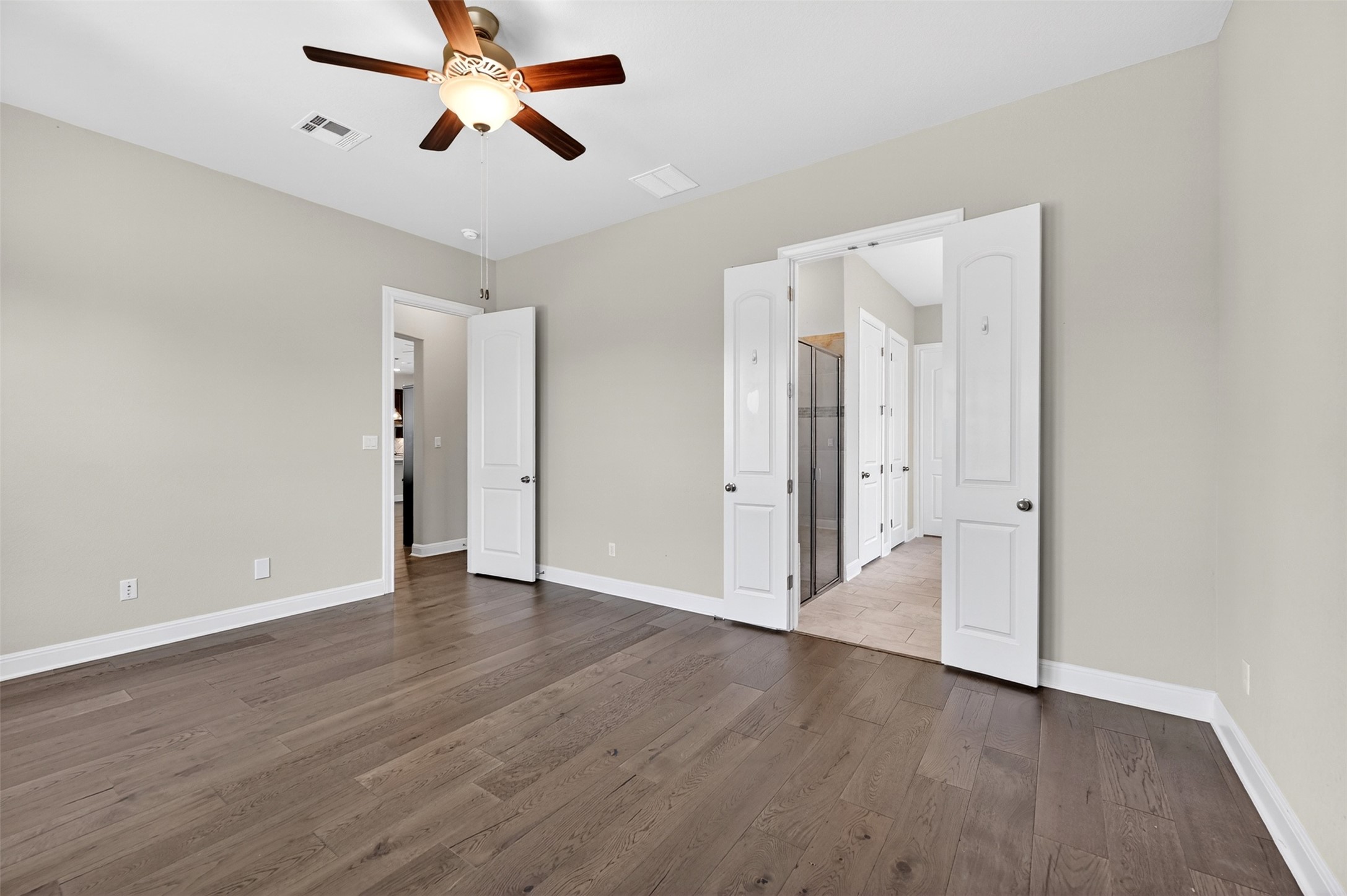 1201 Positano Pass Leander, TX 78641 - Photo 24 of 40 Spacious room featuring wide plank wood-finish flooring and neutral wall tones