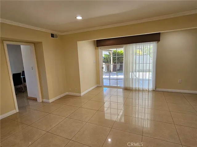 a view of an empty room and window