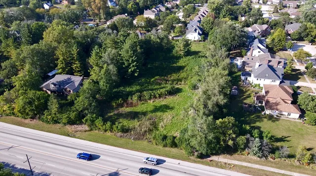 an aerial view of residential house with outdoor space and street view