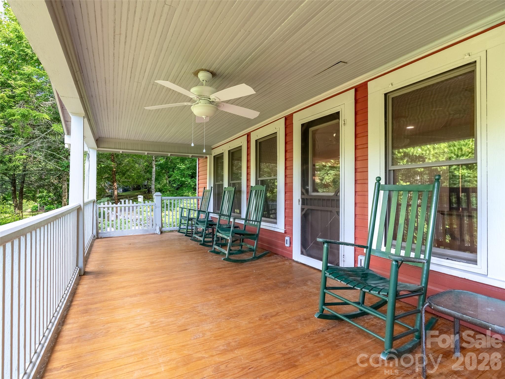 206 Chestnut Hill Road Gerton, NC 28735 - Photo 21 of 48 a balcony with furniture and a garden