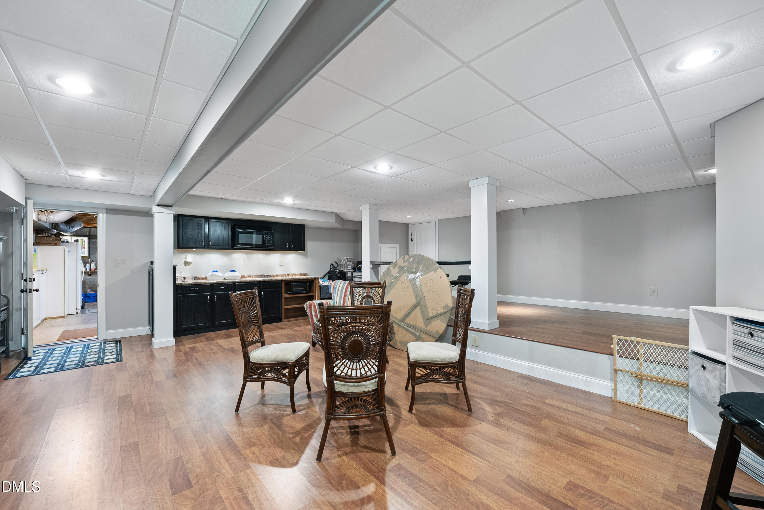 6200 Splitrock Trail Apex, NC 27539 - Photo 63 of 64 a view of a dining room with furniture and wooden floor