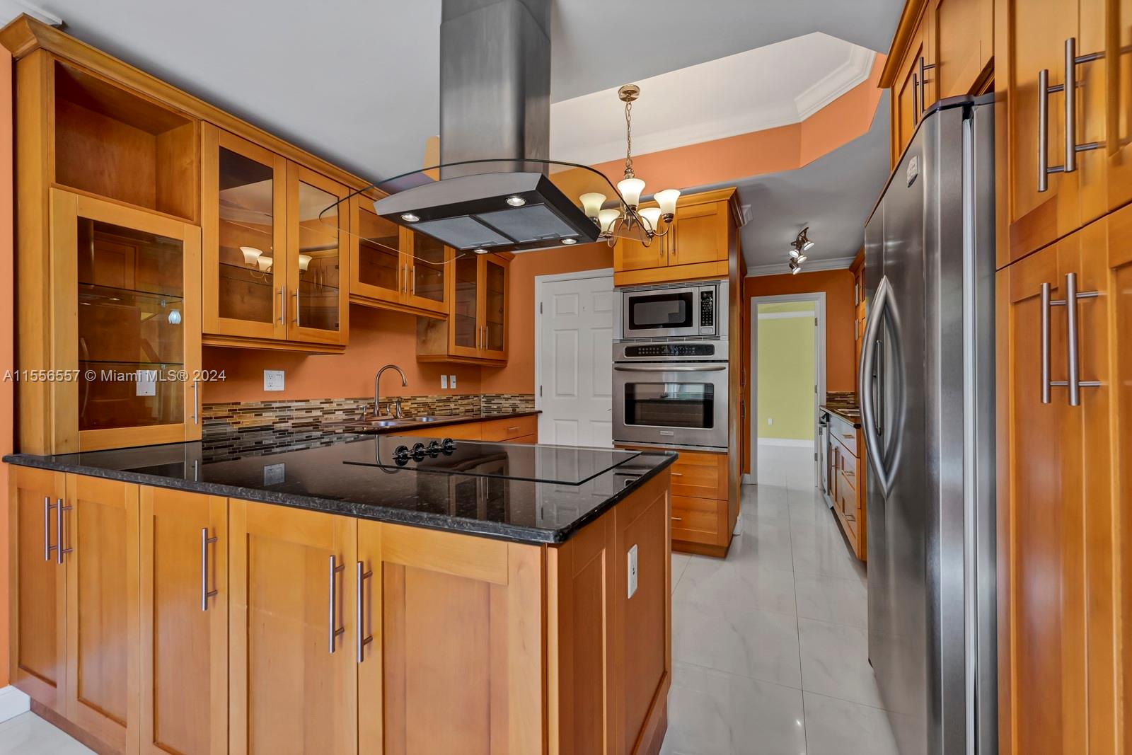 4014 Southwest 144th Place Miami, FL 33175 - Photo 22 of 50 a kitchen with stainless steel appliances granite countertop a refrigerator and a sink