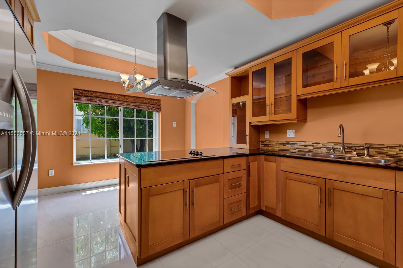 4014 Southwest 144th Place Miami, FL 33175 - Photo 24 of 50 a kitchen with stainless steel appliances granite countertop a sink and a cabinets