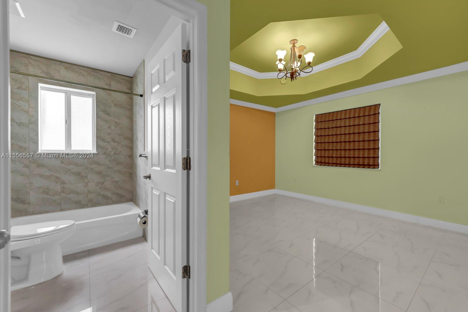 4014 Southwest 144th Place Miami, FL 33175 - Photo 27 of 50 a view of an entryway with a chandelier