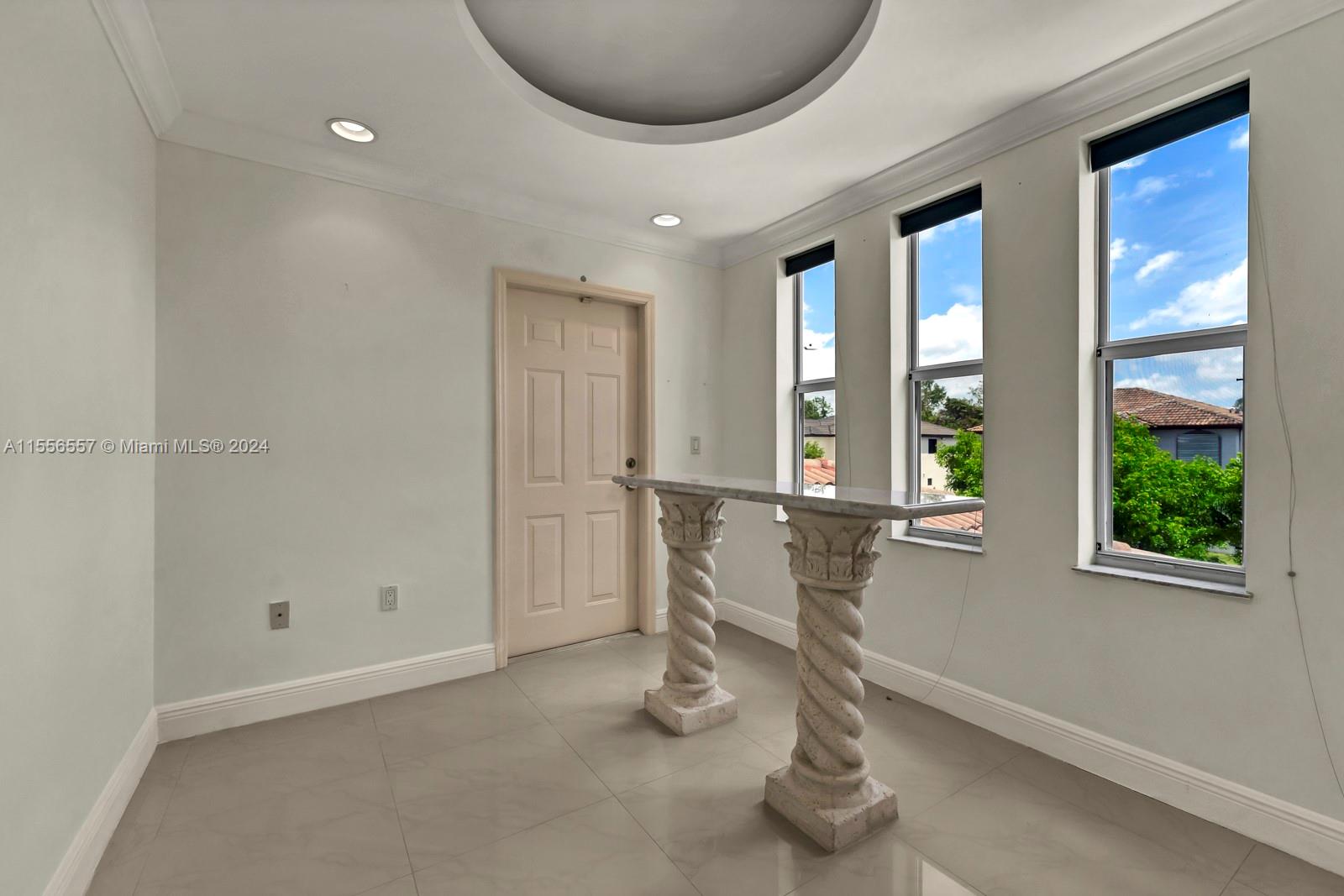 4014 Southwest 144th Place Miami, FL 33175 - Photo 30 of 50 a room with gym equipment and windows