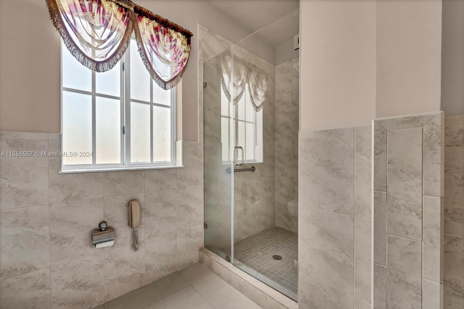 4014 Southwest 144th Place Miami, FL 33175 - Photo 33 of 50 a bathroom with a bathtub and a shower