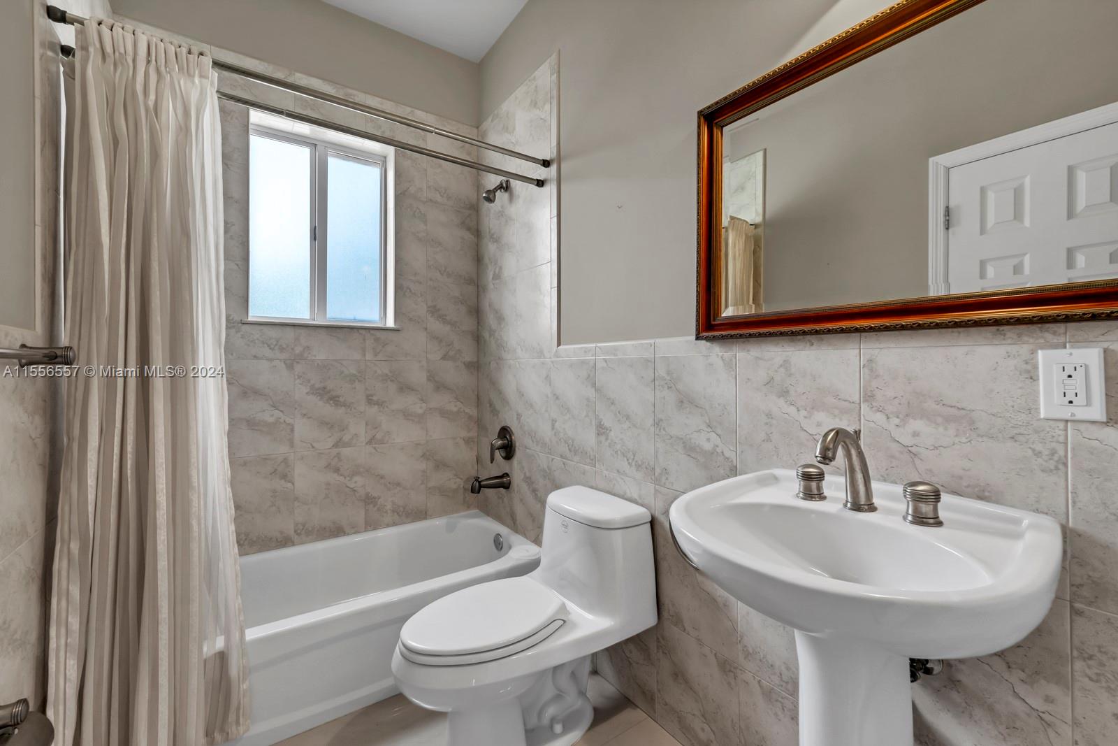 4014 Southwest 144th Place Miami, FL 33175 - Photo 40 of 50 a bathroom with a sink toilet and shower