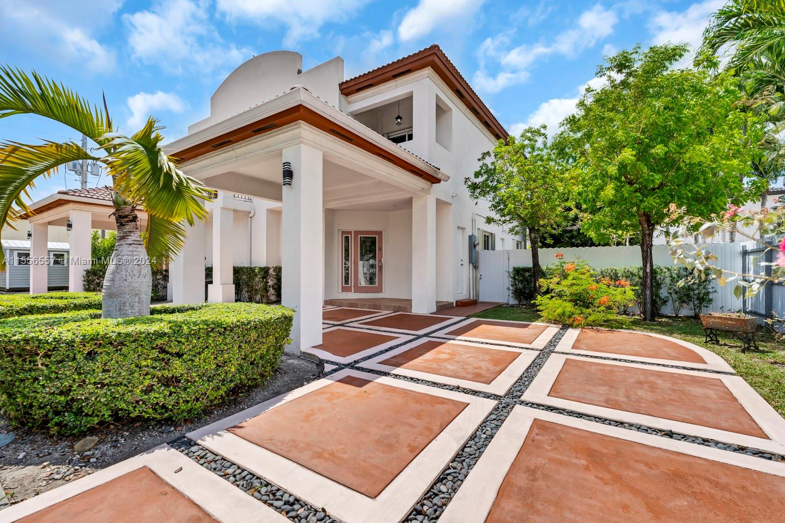 4014 Southwest 144th Place Miami, FL 33175 - Photo 5 of 50 a front view of a house with garden