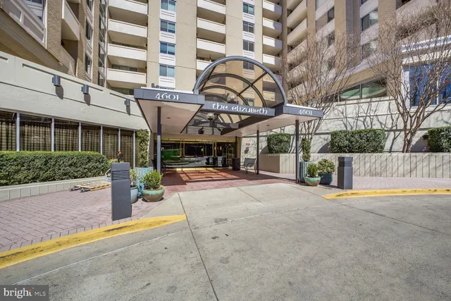 a large white kitchen with a large window
