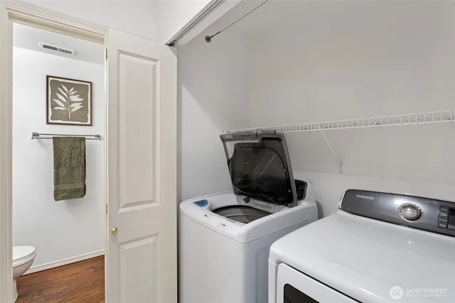 a view of storage and utility room with washer and dryer