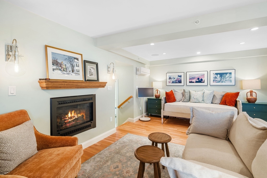 24 Lee Street, Unit B10 Marblehead, MA 01945 - Photo 16 of 33 a living room with furniture and a fireplace