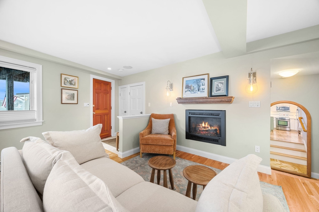 24 Lee Street, Unit B10 Marblehead, MA 01945 - Photo 18 of 33 a living room with furniture and a fireplace