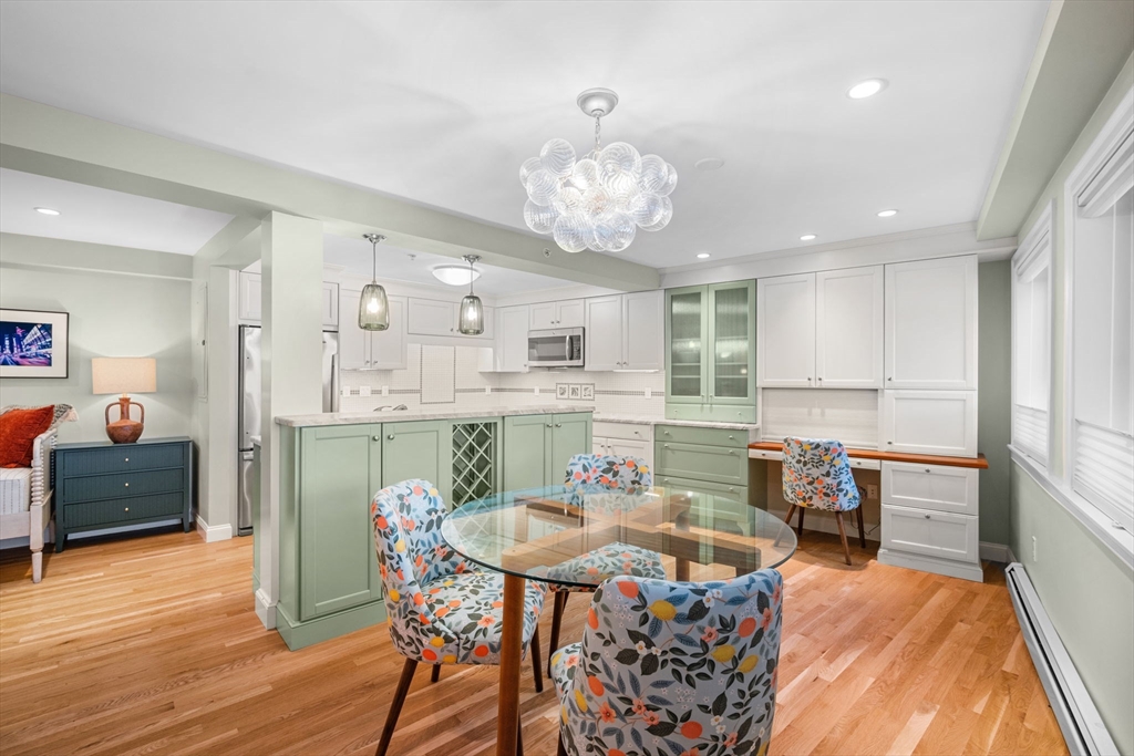 24 Lee Street, Unit B10 Marblehead, MA 01945 - Photo 19 of 33 a view of a dining room with furniture window and wooden floor