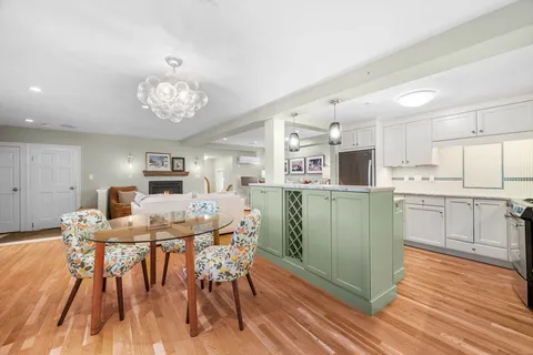 a view of kitchen with cabinets and wooden floor