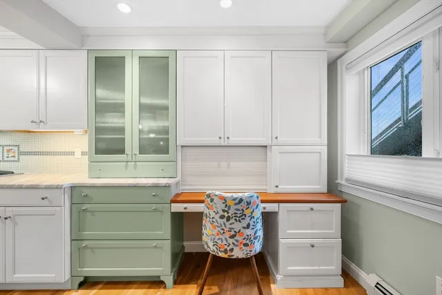 a kitchen with a cabinets and a window
