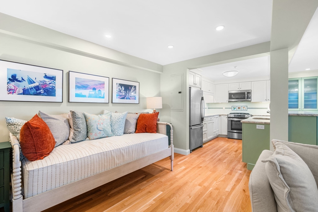 24 Lee Street, Unit B10 Marblehead, MA 01945 - Photo 25 of 33 a bed room with a bed and a couch