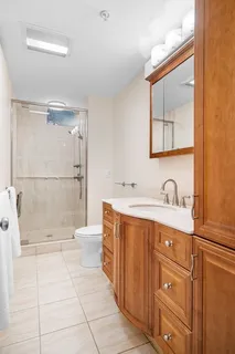 a bathroom with a tub sink and mirror
