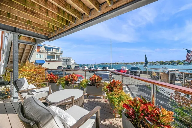 a view of a balcony with chairs