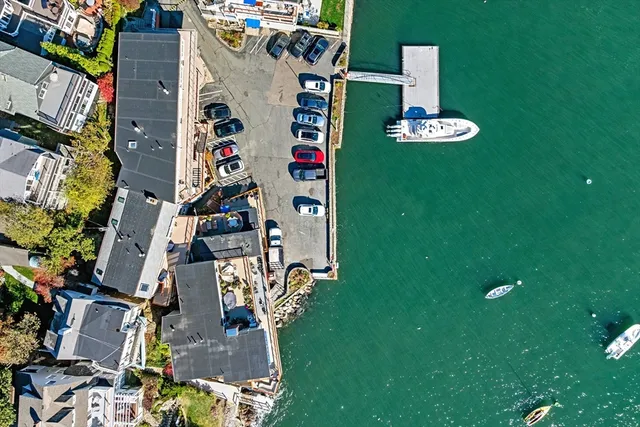 a front view of multi story residential apartment building with yard
