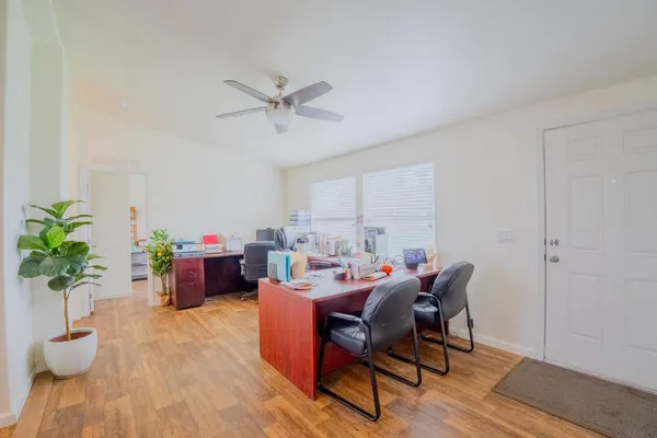 a view of a dining room with furniture and a fireplace