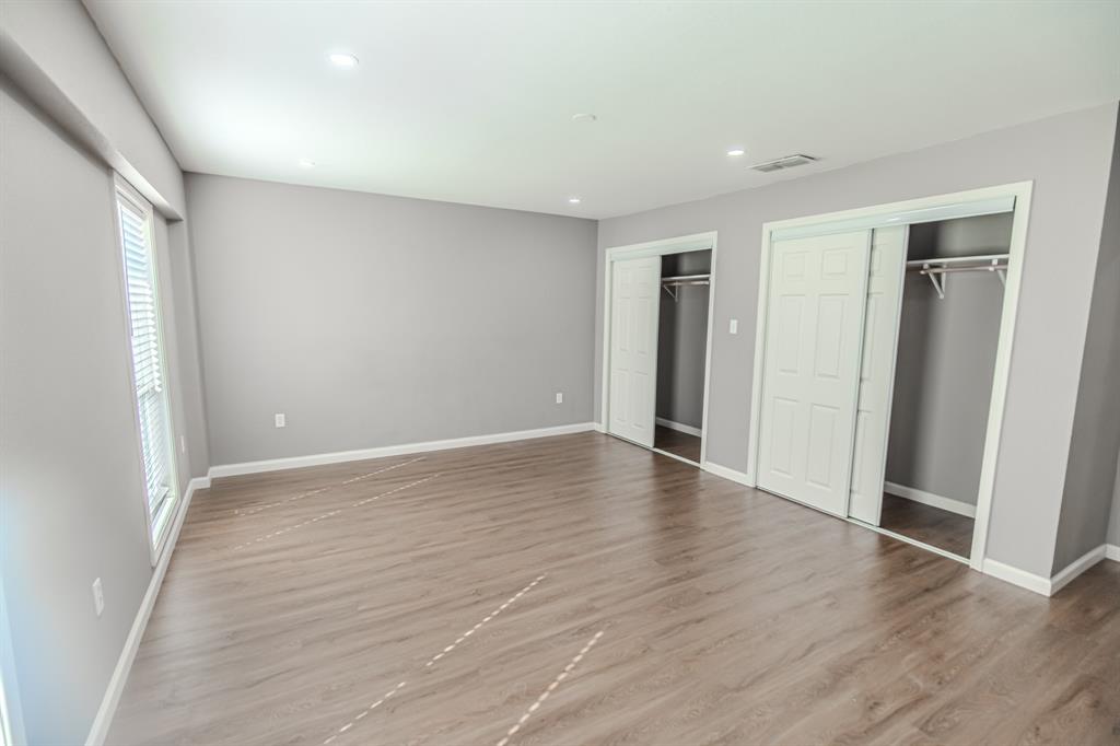 108 Gettysburg Drive Comanche, TX 76442 - Photo 12 of 39 a view of an empty room with wooden floor and closet