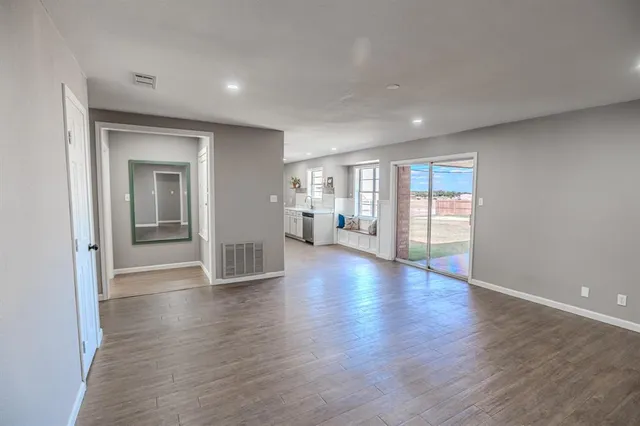 a backyard of a house with outdoor seating