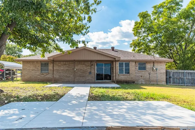 a view of swimming pool with sitting area and garden