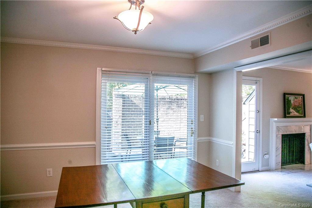 4417 Simsbury Road Charlotte, NC 28226 - Photo 11 of 42 a view of an empty room with a window and fire place