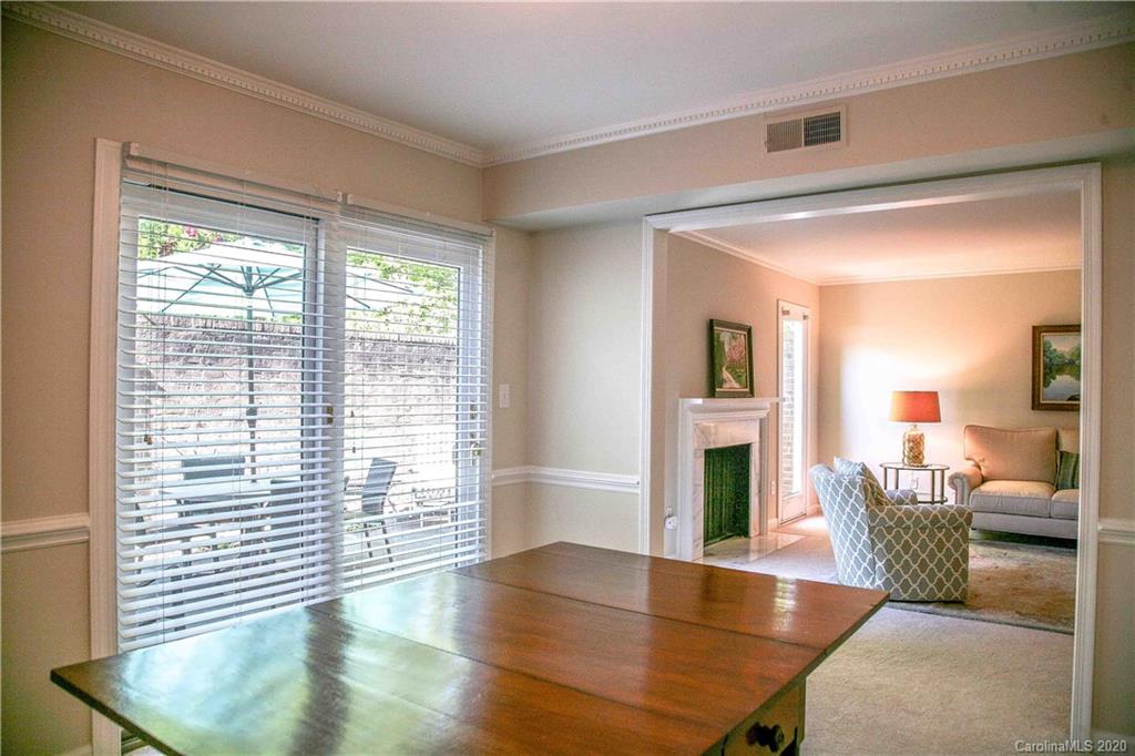 4417 Simsbury Road Charlotte, NC 28226 - Photo 12 of 42 a living room with furniture and a fireplace