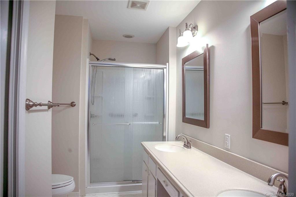 4417 Simsbury Road Charlotte, NC 28226 - Photo 16 of 42 a bathroom with a sink toilet and shower