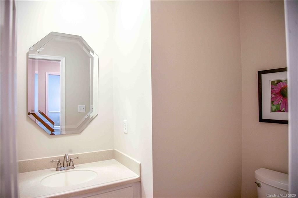 4417 Simsbury Road Charlotte, NC 28226 - Photo 17 of 42 a bathroom with a sink and a mirror