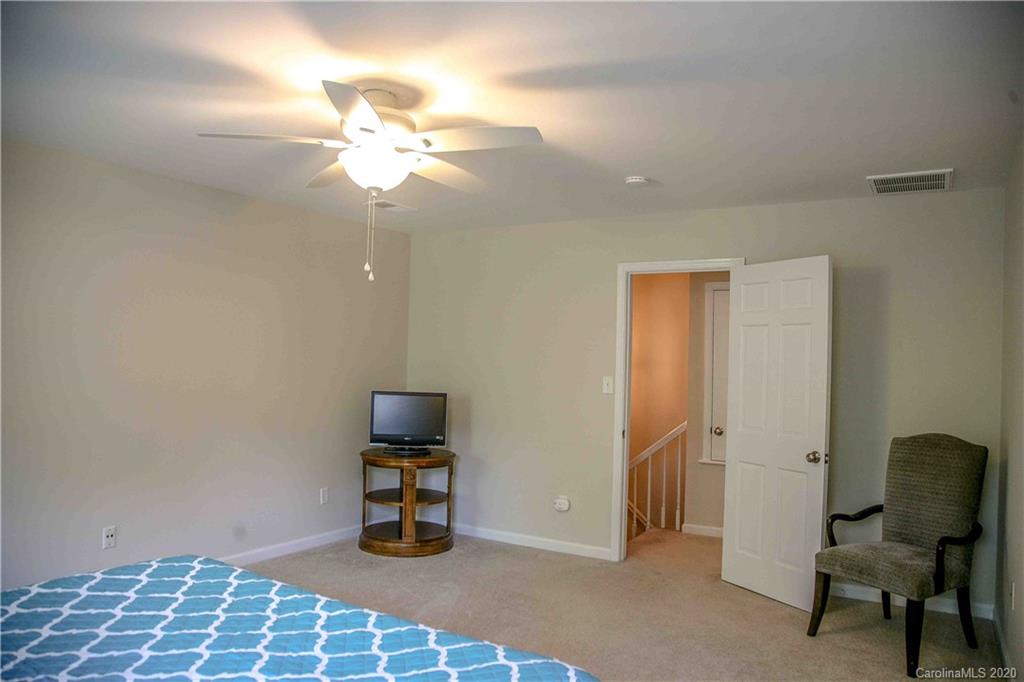 4417 Simsbury Road Charlotte, NC 28226 - Photo 20 of 42 a bedroom with a workspace