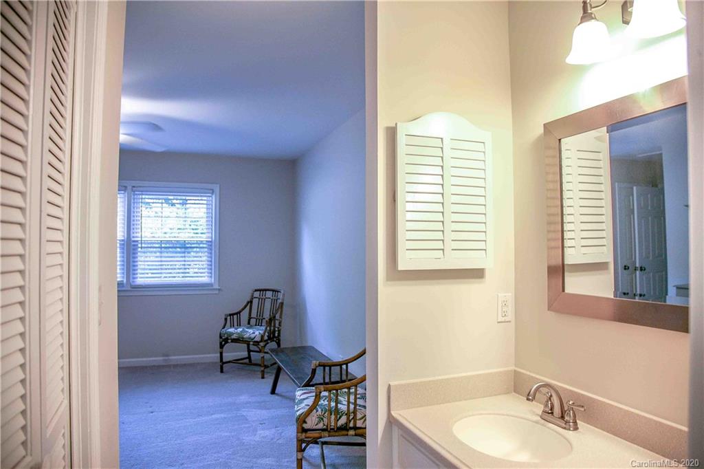 4417 Simsbury Road Charlotte, NC 28226 - Photo 22 of 42 a bathroom with a window bathtub and a sink