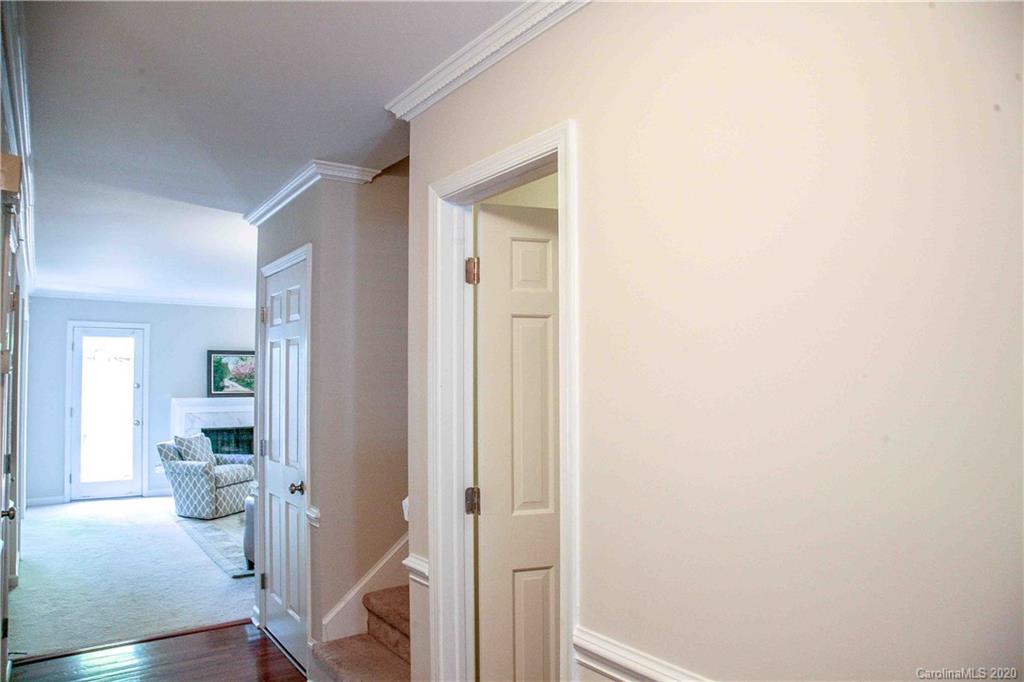 4417 Simsbury Road Charlotte, NC 28226 - Photo 27 of 42 a room with wooden floor and a bathroom
